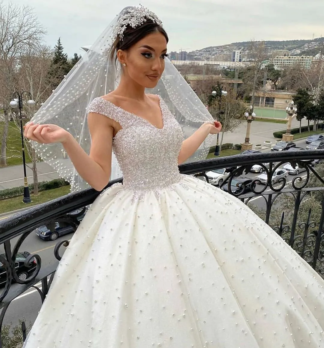 Sweetheart Off-the-Shoulder Backless Ball Gown Wedding Dress with Pearl Beading and Ruffles